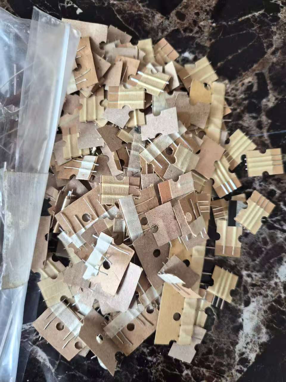 Paper-backed tin-plated steel scrap